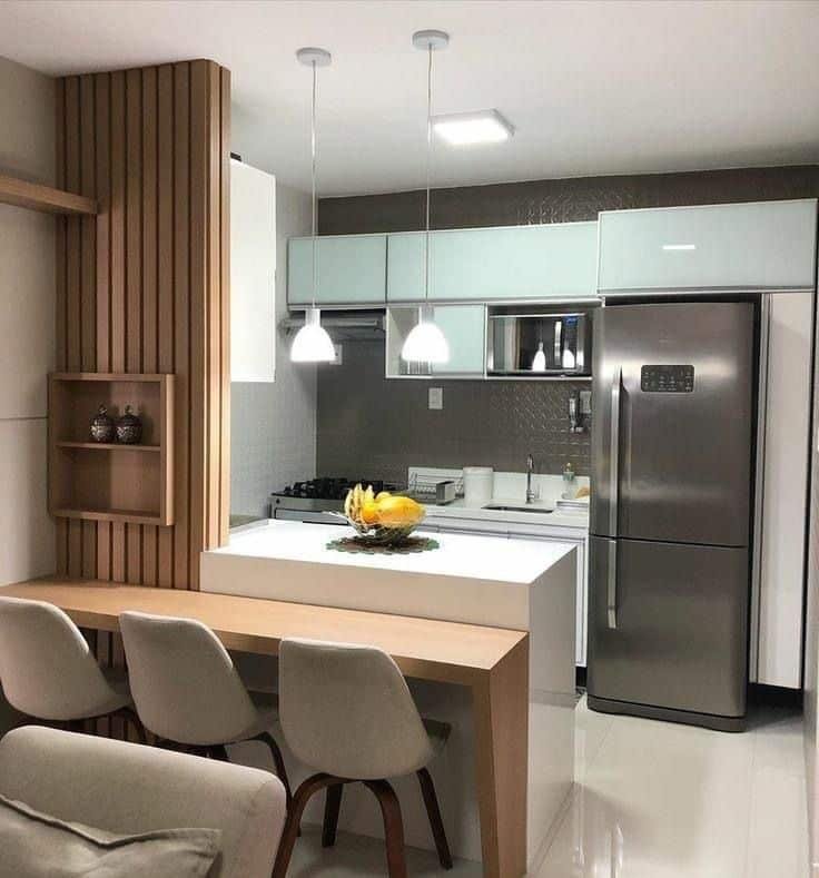 5 Maneiras de Usar a Tendência do Metal na Decoração 4 Cozinha com geladeira em inox